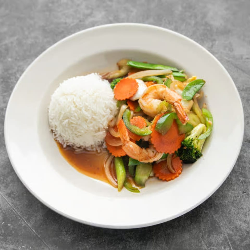 Mai Thai Restaurant's shrimp stir-fry with rice, carrots, broccoli, and green peppers.